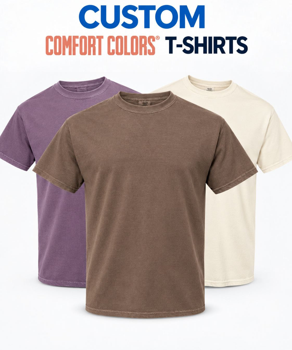 Three short-sleeve crew-neck t-shirts in purple, brown, and cream are displayed against a white background with the text 'CUSTOM COMFORT COLORS T-SHIRTS' at the top.